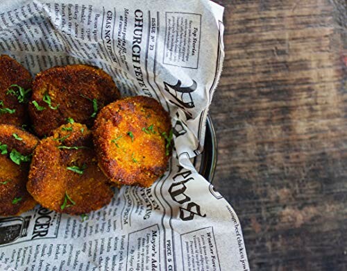 Crispy fried patties on newspaper-lined plate